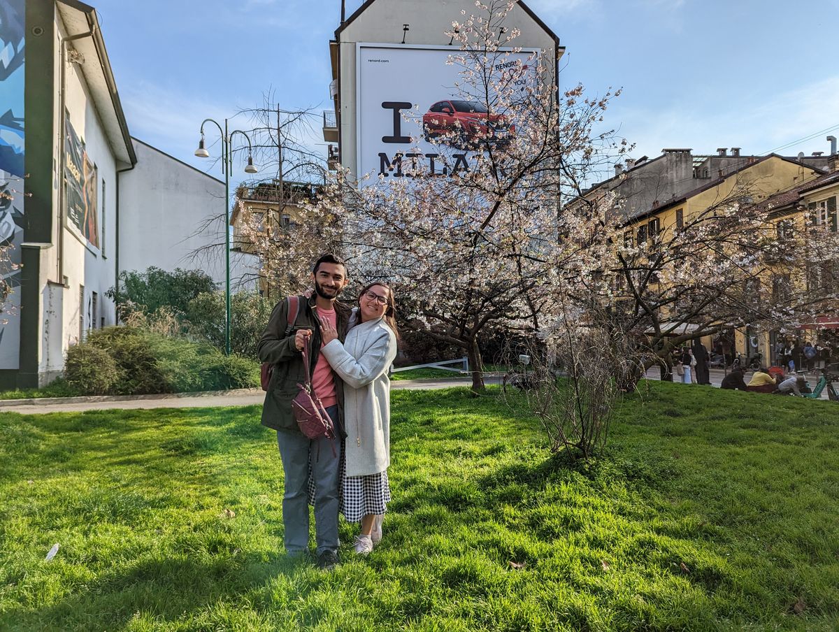 Couple in a Milan park with blossoming trees
